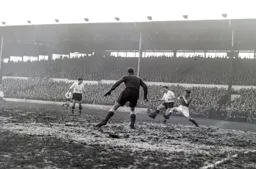 Mick Cullen beats Eric Moore to the ball