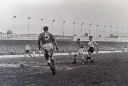 The ball is just blur as Bob Morton attempts a shot at goal