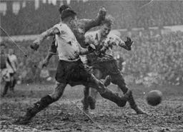 Seamus Dunne and Bud Aherne cannot stop this shot on goal