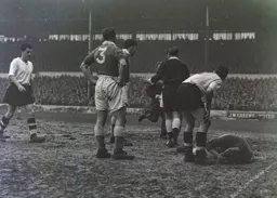 George Cummins and Mick Cullen show concern as City keeper Gil Merrick lays injured