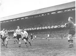 Wally Shanks covers as Ron Baynham catches the ball