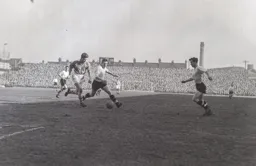 Tony Gregory has Jimmy Adam in support as Ray Hartle moves in to challenge