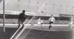 Tony Gregory watches as Ken Grieves catches the ball