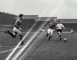 Tony Gregory tries to hold off Jimmy Dugdale