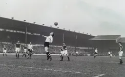 The ball is just too high for Tony Gregory