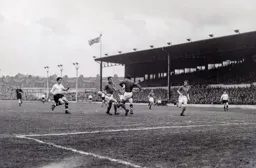 Pompey keeper Norman Uprichard kicks the ball clear as Tony Pounder moves in