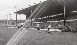 Jimmy Adam`s intended pass is blocked by Stan Anderson
