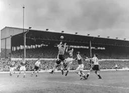 Jimmy O`Neill and Tommy Jones deal with this Town attack Reg Pearace can only wait and watch