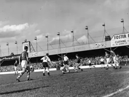 Jack Marsden gets between Tony Gregory and Gordon Turner to clear the ball