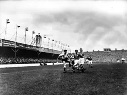 John Groves gets stuck in to try and win the ball