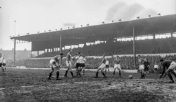 Reg Pearce and six Blackpool defenders watch as the ball goes harmlessly through to George Farm