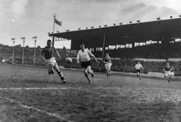 Allan Brown and Peter Sillett chase a loose ball