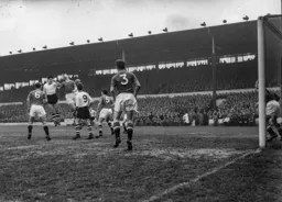 Gordon Turner and Freddie Goodwin compete for the ball