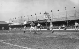 Allan Brown misjudges the flight of the ball