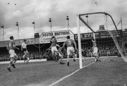 Eddie Hopkinson and the massed ranks of the Bolton defence halt this Town attack. Allan Brown is on hand should the ball come loose