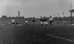Tommy Jones covers for Everton as Allan Brown looks for an opening