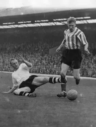 Seamus Dunne goes in to slide tackle Colin Grainger