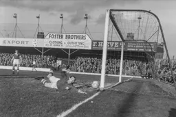 City keeper Gil Merrick tips this shot around the post
