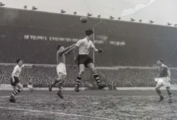 John Groves looks to find Gordon Turner as he flicks the ball on with his head