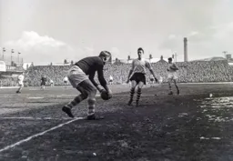 Bert Trautmann picks the up in front of John Groves
