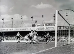 John Groves and Allan Brown watch the ball drift wide of the post
