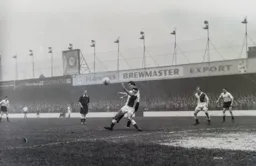 Brendan McNally challenges for the ball with future Hatter Matt Woods
