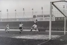 Rovers keeper Harry Leyland keeps hold of the ball as Brendan McNally rushes in