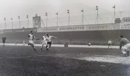 The ball goes forward but it is out of reach for Brendan McNally