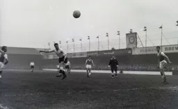 Allan Brown can only direct this header wide of the goal
