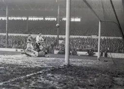 City keeper Gil Merrick's brave action forces Allan Brown to send the ball over the crossbar
