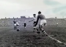 Gordon Turner is closed down by City keeper Gil Merrick