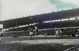 Allan Brown climbs above Trevor Smith in this heading duel