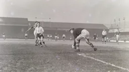 Billy Bingham can only watch as Roy Wood gathers the ball into his hands