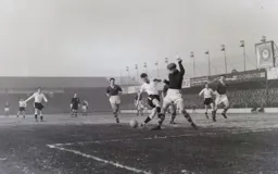 Billy Bingham is tackled by Leeds keeper Roy Wood