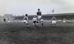 Bob Morton looks on as Roy Bailey catches the ball