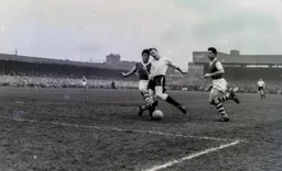 Tony Gregory avoids Ken Malcolm`s tackle and powers through to score the Town`s fourth goal