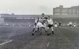 Allan Brown is beaten to the ball as Roy Bailey puts a halt to this Town attack