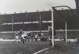 Allan Brown is foiled by the out stretched boot of Ian King