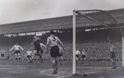 Allan Brown watches as City keeper Sandy Kennon catches the ball