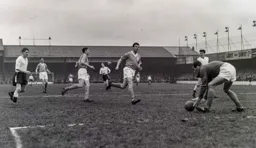Blackpool keeper George Farm gathers the ball as John Kilgannon looks on