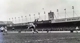 Gordon Turner and Roy Gratrix collide after missing the ball