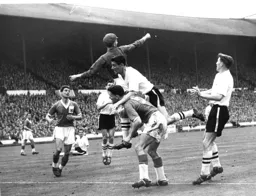 John Groves climbs all over Billy McKinley