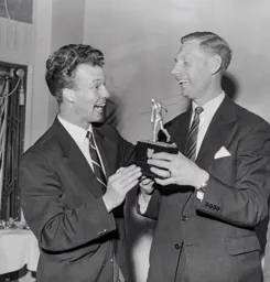 Billy Bingham congratulates Syd Owen on his Footballer of the Year award