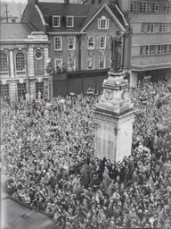 Crowds gather to greet the returning team