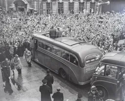 The players get off the coach at the Town Hall