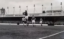 Chelsea goalkeeper Reg Matthews safely gathers the ball