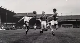 Billy Bingham looks to control the ball