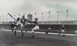 Allan Brown gets his head to the ball