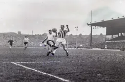 Joe McBride in a tussle with Don Howe