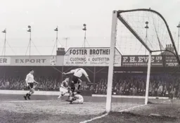 Billy Bingham hurdles the goalkeeper